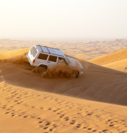  The image of a desert safari can be seen as a representation of the unique and exciting experiences that are available in Dubai.