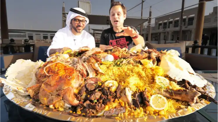Image of two men having a traditional Emirati meal