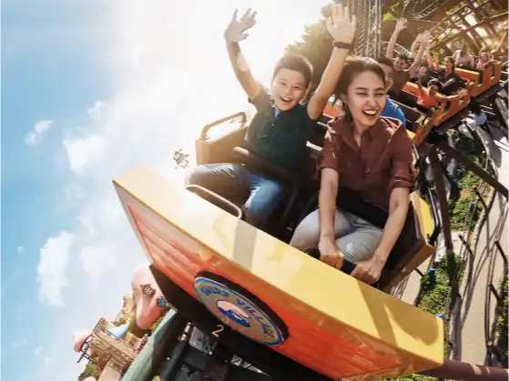 two young adults taking a ride in a theme park in Dubai